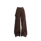 Black distressed sweatshirt layered over yellow plaid flannel with brown cargo pants, product photo 9