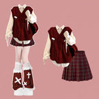 Burgundy cable knit vest with white shirt and plaid skirt, full outfit front view