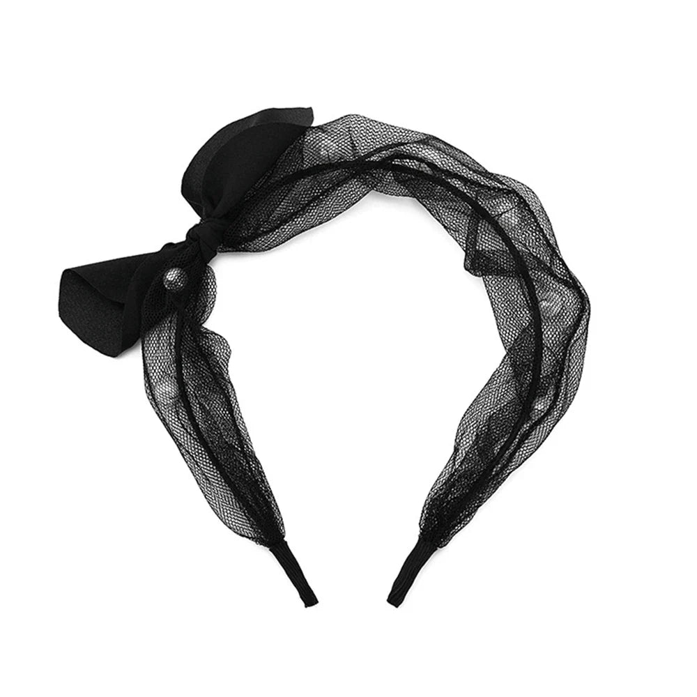 Black mesh ruffle headband with side bow, angled front view