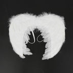 White feather angel wings front view on black background