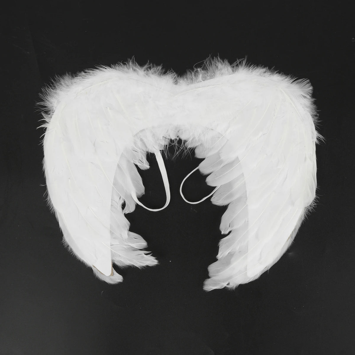 White feather angel wings front view on black background