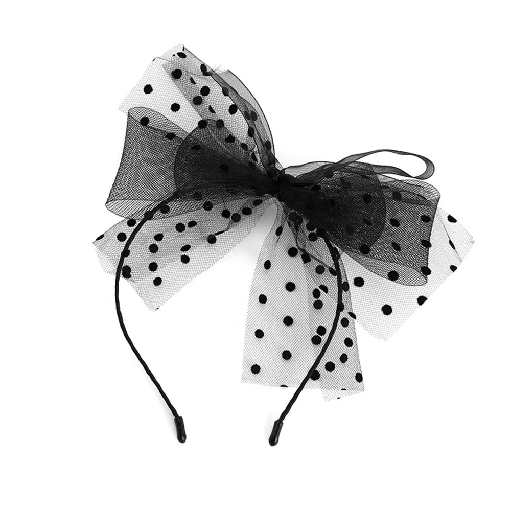 Large black polka dot tulle bow headband, front view