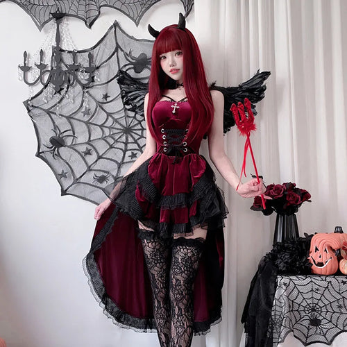 Model wearing burgundy gothic Halloween dress with trident, full body front view