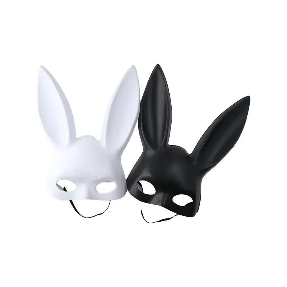 White and black matte bunny ear masquerade masks with straps, tilted front view