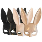 Black, white and beige glossy bunny ear masks lined up, front view