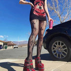 Patterned fishnet tights butterfly design