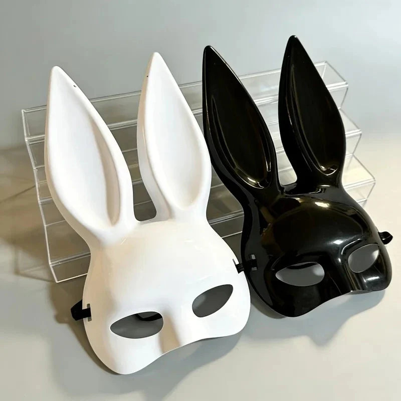 White and black glossy bunny ear masquerade masks displayed side by side