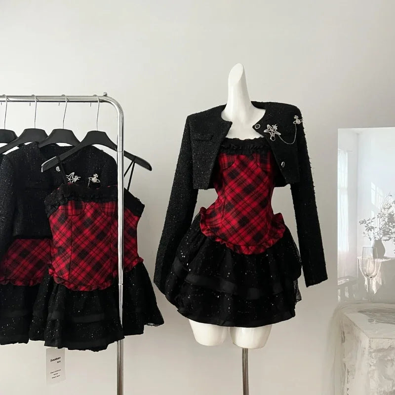 Red plaid corset and black ruffled skirt set with black tweed jacket on mannequin