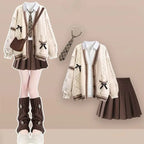 Cream cable knit cardigan with shirt tie and pleated skirt, full outfit front view
