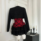 Red plaid corset skirt set with black tweed jacket on mannequin, back view