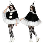 Model front and back in black velvet pierrot poncho with white pom poms, hat, striped tights