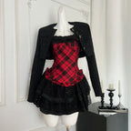 Red plaid corset and black ruffle skirt set with tweed jacket on mannequin, front