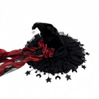 Black lace witch hat with red bow and star fringe, flat lay front view