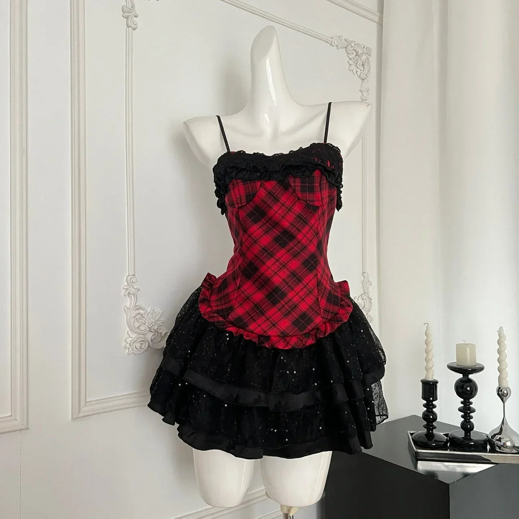 Red plaid lace trim corset with black ruffled mini skirt on mannequin, front view