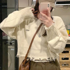 Cream Wool Coat Sweater and Wide Leg Jeans Set, close-up of the cream knit sweater with raw frayed hem