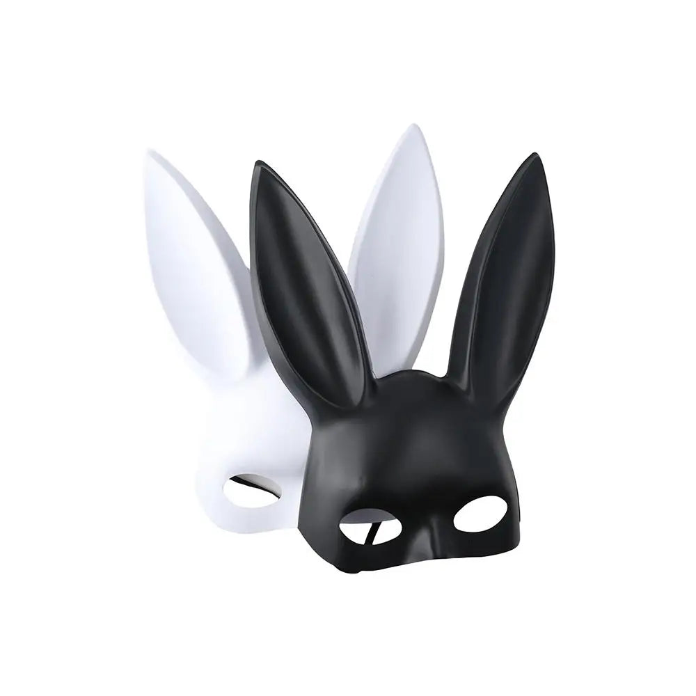 Black matte bunny ear mask in front of white mask, angled view