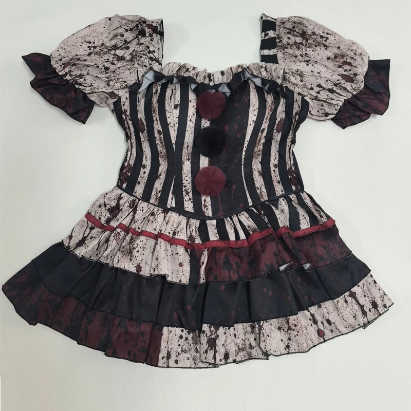 Bloody clown striped jester dress with red pom poms, flat lay front view