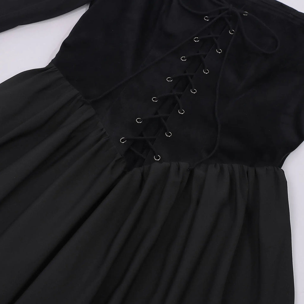 Close up of lace up corset front and sheer bell sleeve on black witch Halloween dress