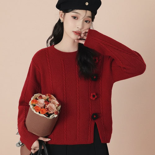 Woman wearing a red college style loose pullover sweater holding a bouquet of flowers and wearing a black beret
