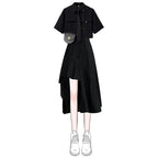 Black two piece punk dress outfit with short sleeve top and asymmetrical skirt paired with white sneakers
