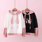 Casual japanese cute hoodie with cartoon print in white and black with pink accents from Vusy Kawai Shop