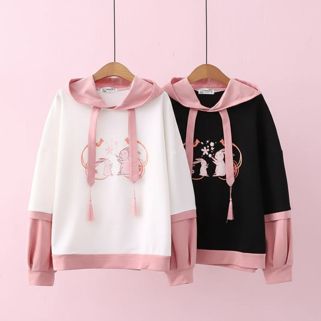 Casual japanese cute hoodie with cartoon print in white and black with pink accents from Vusy Kawai Shop