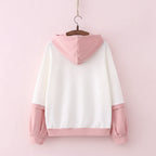 Back view of casual japanese cute hoodie with cartoon print featuring white and pink color block design