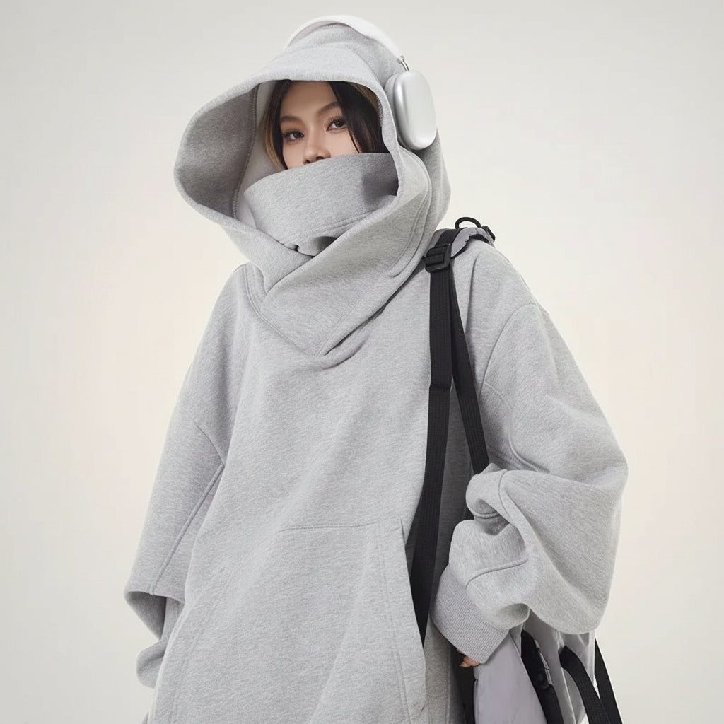Gray oversized casual Japanese streetwear fashion hoodie with high neck and large hood worn by a model