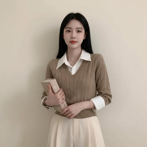 Woman wearing brown casual knitwear for women layered over a white collared shirt holding a book