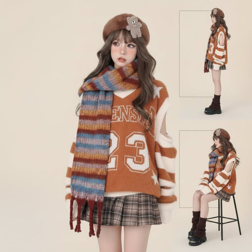 Woman wearing college style black sweater for women with striped sleeves, plaid skirt, and colorful scarf