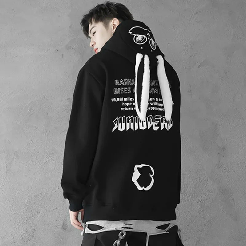 Black cute animal couple hoodie for teens with white character hood details and printed back design