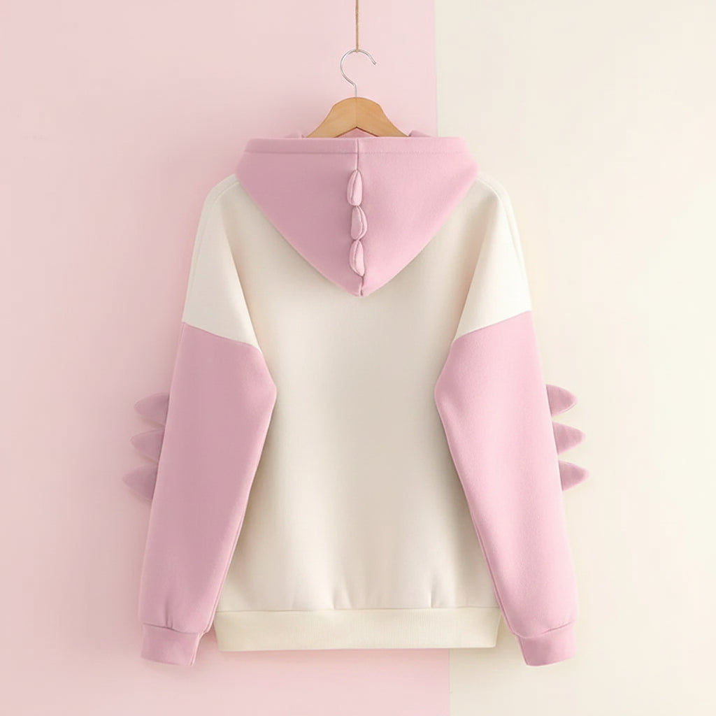 Back view of cute dinosaur hoodie for winter in cream and pink with dinosaur spikes on sleeves and hood