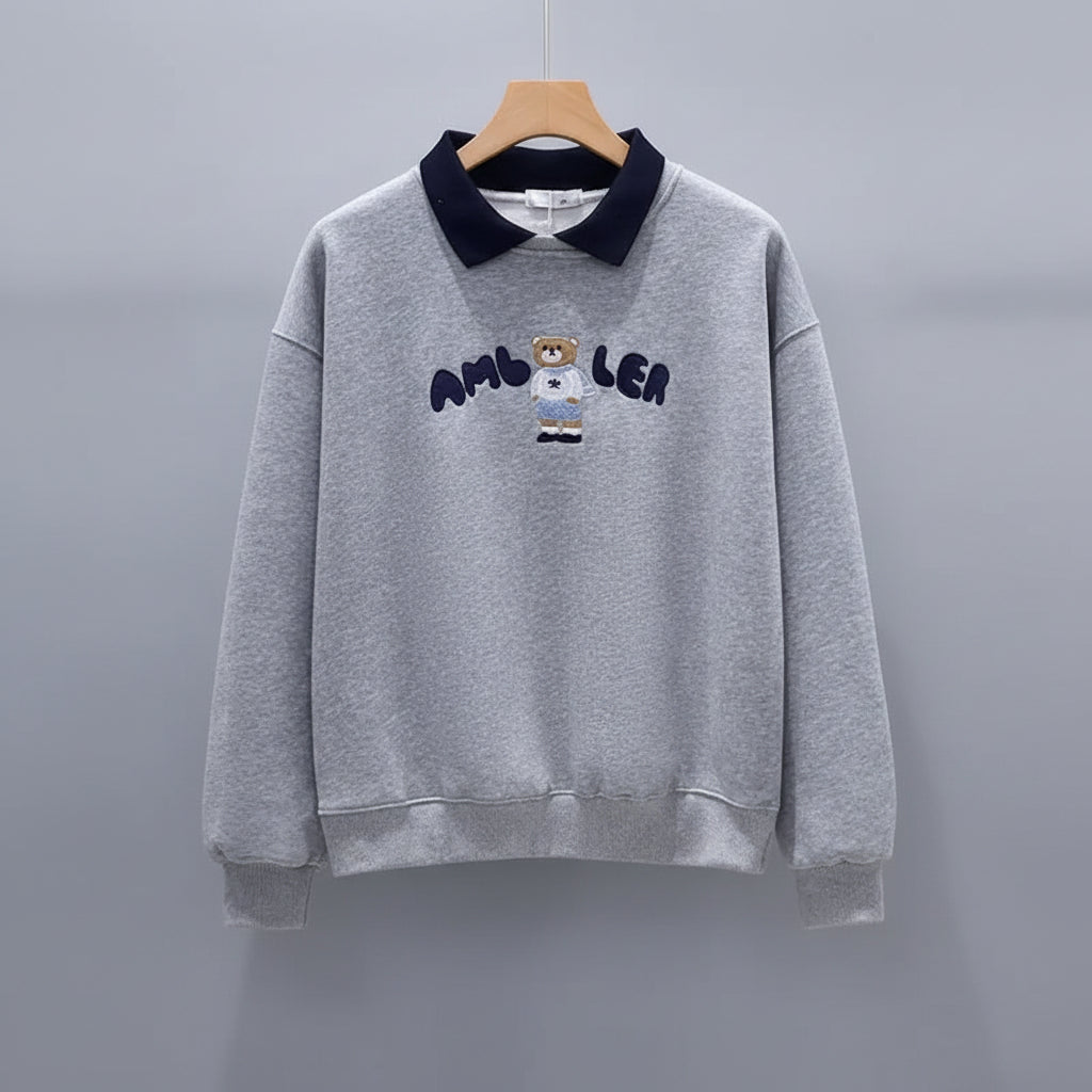 Cute embroidered long sleeve preppy top in gray with navy collar and bear design on front