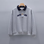 Cute embroidered long sleeve preppy top in gray with navy collar and bear design on front
