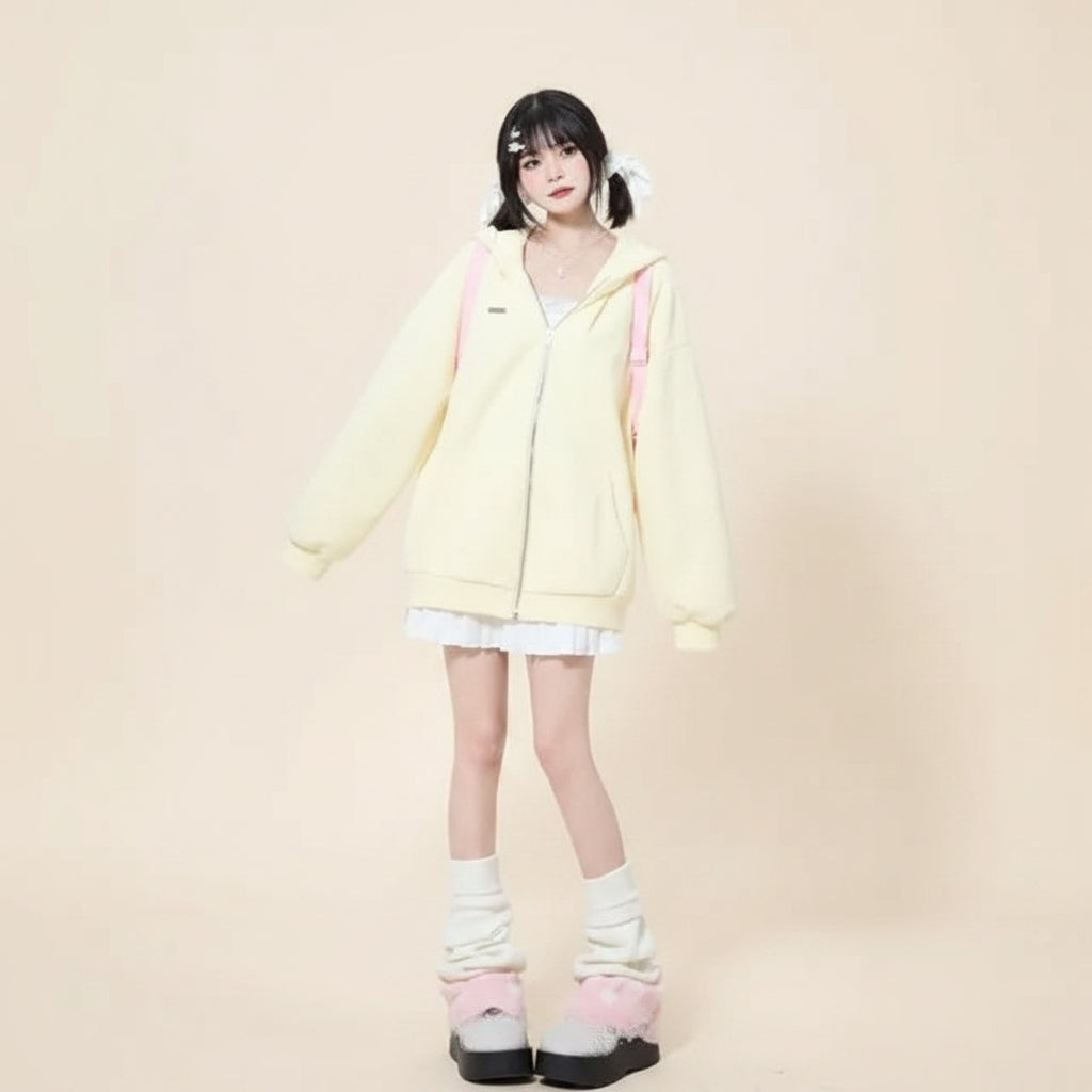 Cute hooded rabbit cardigan for women in soft yellow worn by model with white dress and pink slippers