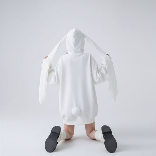 Back view of a woman wearing a cute hooded rabbit cardigan for women with long ears and a pom pom tail