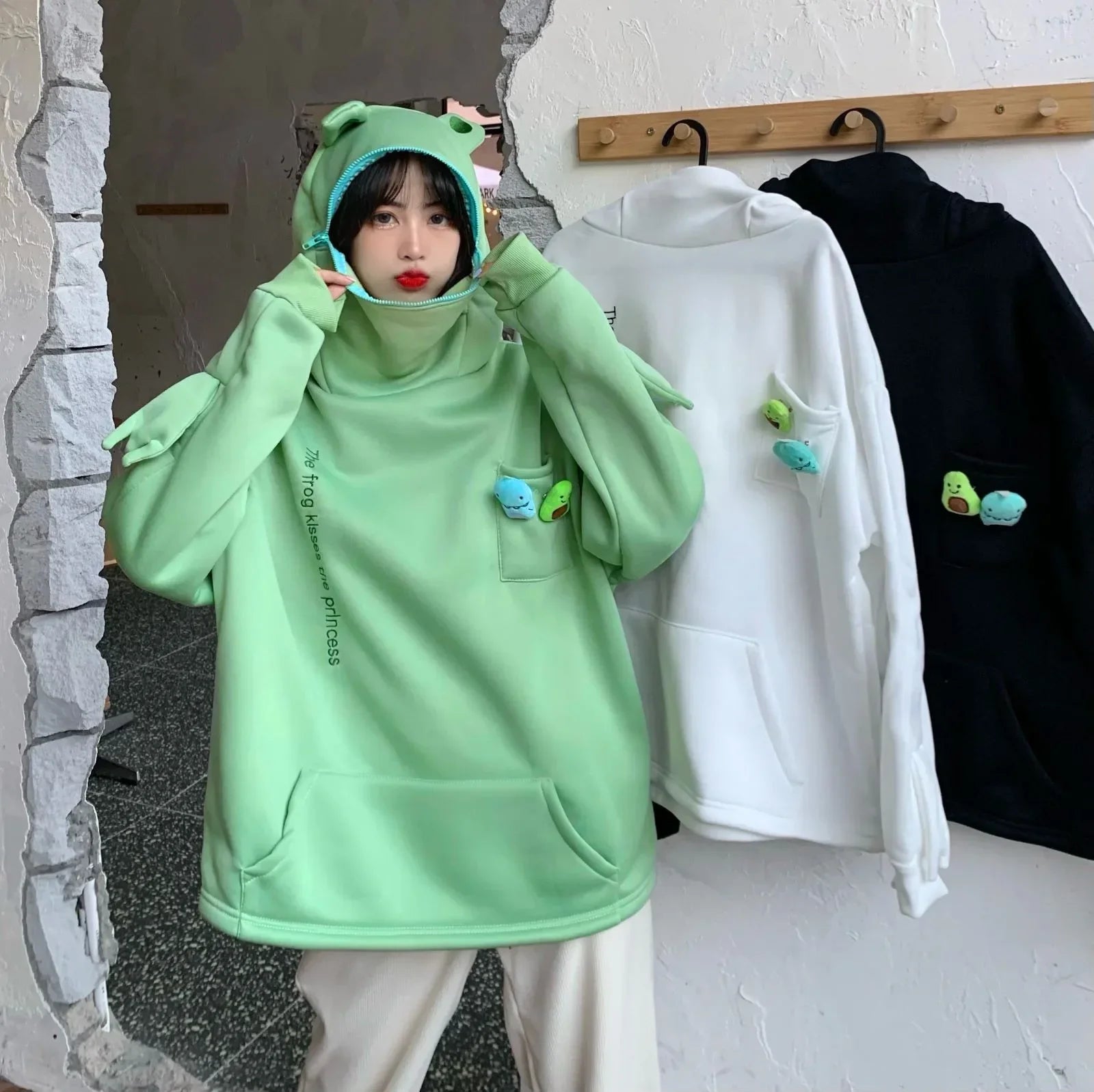 Cute Japanese autumn couple sweatshirts in green, white, and black with playful character designs