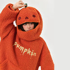 Cute pumpkin hoodie for women in orange with a pumpkin face hood and cozy fleece fabric