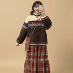 Cute retro apple knitted cardigan in brown with patterned details worn with a red plaid skirt and matching bag