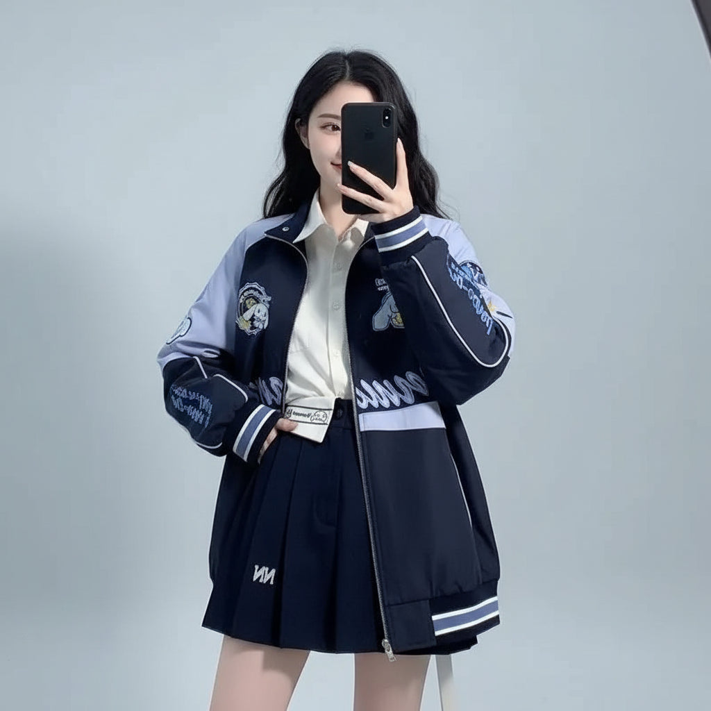 Vusy Kawai Shop embroidered baseball cap style jacket in navy with white accents worn over a school uniform