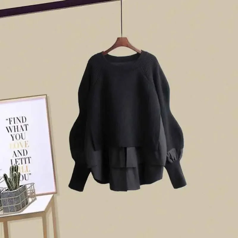 Black fashionable slimming skirt set for women with layered skirt and long sleeve top hanging on wooden hanger