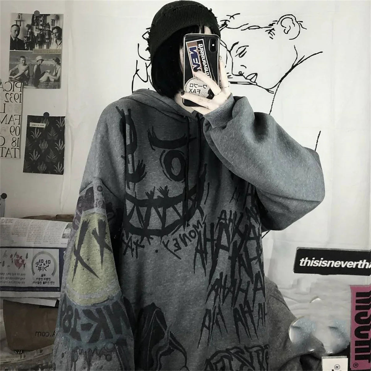 Funny punk japanese cartoon hoodie girl wearing oversized gray graphic hoodie with black beanie