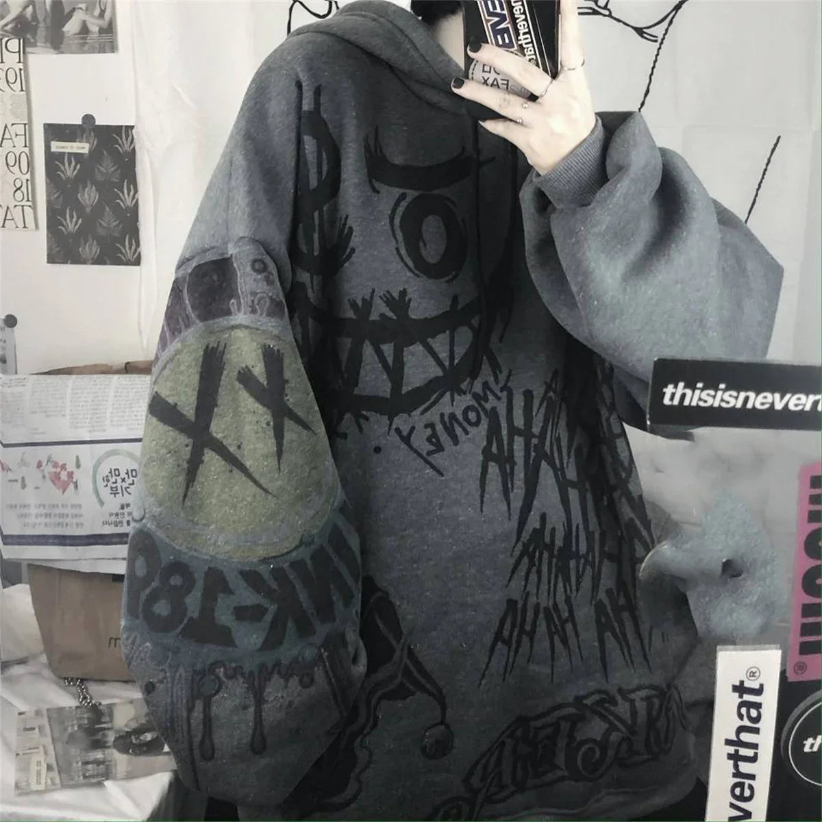 Funny punk Japanese cartoon hoodie girl wearing oversized dark gray hoodie with graphic designs