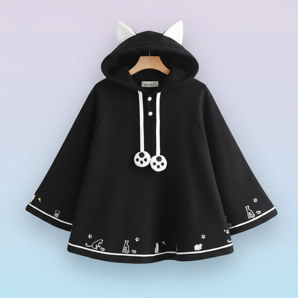 Black Harajuku style cape for women with white cat ears hood and cute paw print details