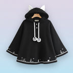 Black Harajuku style cape for women with white cat ears hood and cute paw print details