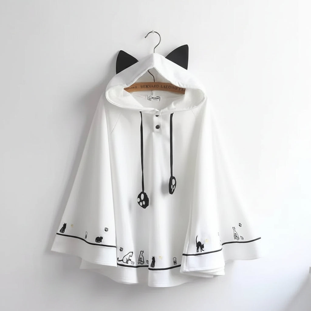 White Harajuku style cape for women with black cat ear hood and cat paw details on sleeves