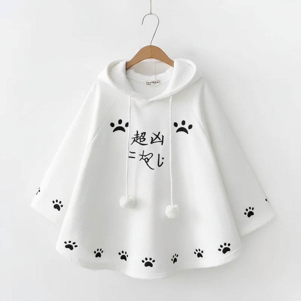 White Harajuku style cape for women with black paw prints and hood from Vusy Kawai Shop