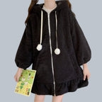 Japanese cute rabbit ear hoodie for women in black fluffy fabric with pom pom drawstrings and ruffled hem
