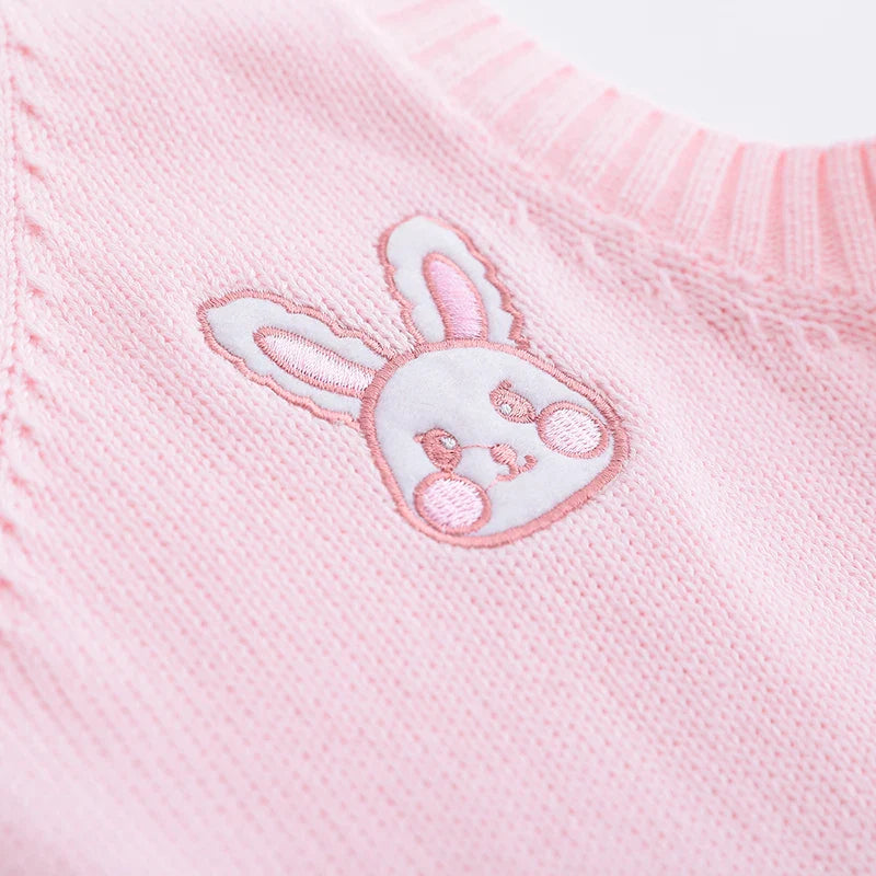 Close-up of a pink Japanese style rabbit knit vest with embroidered bunny face detail