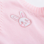 Close-up of a pink Japanese style rabbit knit vest with embroidered bunny face detail